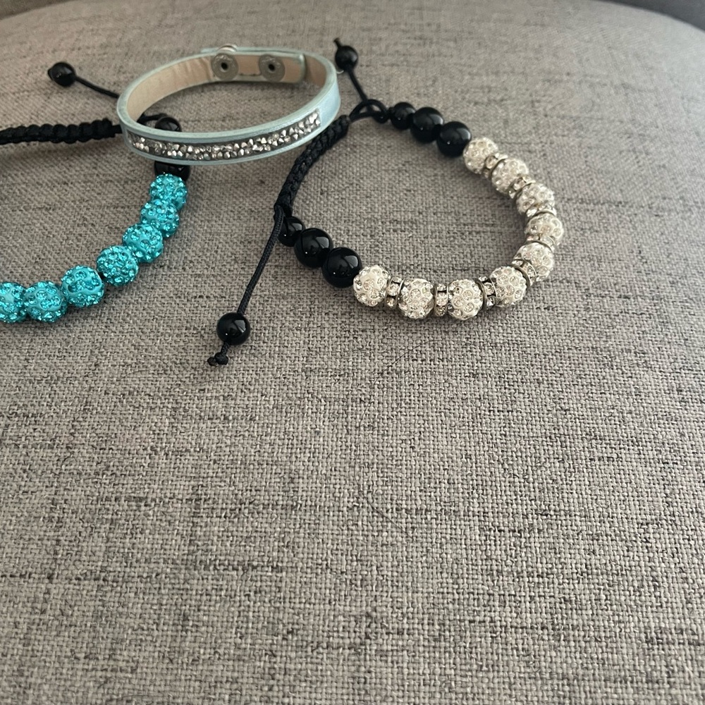Three misc bracelets with bling